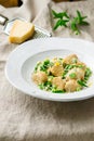 Buckwheat nudi with green peas and parmesan