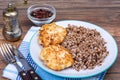 Buckwheat porridge with cutlets on white plate Royalty Free Stock Photo