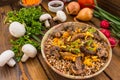 Buckwheat porridge with meat and mushrooms on wooden rustic background. Top view Royalty Free Stock Photo