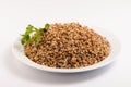 Buckwheat porridge on a white plate Royalty Free Stock Photo