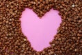 Buckwheat is scattered and in it the heart is pink