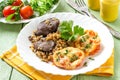 Buckwheat with stewed chicken liver and tomatoes baked with cheese Royalty Free Stock Photo