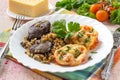 Buckwheat with stewed chicken liver and tomatoes baked with cheese Royalty Free Stock Photo