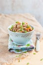 Buckwheat, stewed with meat, carrots and onions on a light background