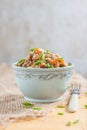 Buckwheat, stewed with meat, carrots and onions on a light background