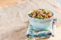 Buckwheat, stewed with meat, carrots and onions on a light background