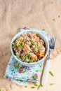 Buckwheat, stewed with meat, carrots and onions on a light background