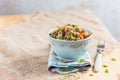 Buckwheat, stewed with meat, carrots and onions on a light background