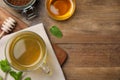 Buckwheat tea, granules and honey on wooden table, flat lay. Space for text