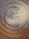 Buckwheat was poured onto a steel slab of a manhole with a radial pattern as food for birds.