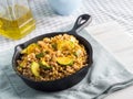 Buckwheat with zucchini and turmeric in skillet