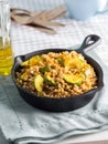 Buckwheat with zucchini and turmeric in skillet