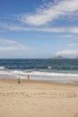 Bucolic image of people observing the CÃÂ­es Islands from a beach in the RÃÂ­a de Vigo