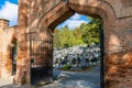 Old brick gate with columns to the city church cemetery Royalty Free Stock Photo