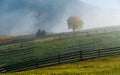 Bucovina autumn sunrise landscape in Romania with mist and mountains