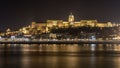 Buda Castle by the Danube river illuminated at night in Budapest, Hungary Royalty Free Stock Photo