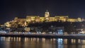 Buda Castle by the Danube river illuminated at night in Budapest, Hungary Royalty Free Stock Photo