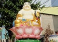 Budai sitting in lotos colorful statue Royalty Free Stock Photo