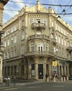 Budapest downtown business area has old buildings with balconies.