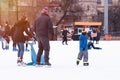 04.01.2022.Budapest.Happy little boy and girl learning to skate in winter.Hobbies and Leisure.Winter sports.Family winter sport.