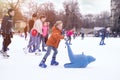 04.01.2022.Budapest.Happy little boy and girl learning to skate in winter.Hobbies and Leisure.Winter sports.Family winter sport.