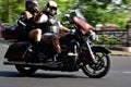 Budapest. Harley Davidson motorcycle convention. rider and passenger on motion.