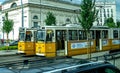 Landscape view of two trams idling side by side, from the Budapest tram lines 47 and 49.