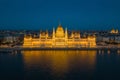 Budapest, Hungary - Aerial blue hour view of the illuminated Parliament of Hungary reflecting on River Danube Royalty Free Stock Photo
