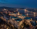 Budapest, Hungary - Aerial drone view of beautiful illuminated Buda Castle Royal Palace at dusk