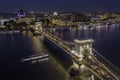 Budapest, Hungary - Aerial drone view of the beautiful illuminated Szechenyi Chain Bridge on a nice summer evening Royalty Free Stock Photo