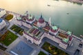 Budapest, Hungary - Aerial drone view of the beautiful Parliament of Hungary at sunset with golden lights on River Danube, Royalty Free Stock Photo