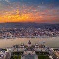 Budapest, Hungary - Aerial panoramic drone view of the Parliament of Hungary at sunset with beautiful dramatic golden clouds Royalty Free Stock Photo