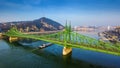 Budapest, Hungary - Aerial panoramic view of beautiful Liberty Bridge Szabadsag Hid with barge going on River Danube