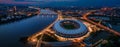 Budapest, Hungary - Aerial panoramic view of Budapest at dusk, including illuminated National Athletics Centre and MOL Campus