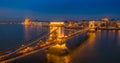 Budapest, Hungary - Aerial panormaic view of the famous illuminated Szechenyi Chain Bridge at blue hour with Parliament building Royalty Free Stock Photo