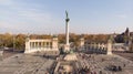 Budapest, Hungary - aerial shot on Angel sculpture from on the top of Heroes` Square and the skyline of Budapest at bac