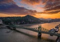 Budapest, Hungary - Aerial skyline view of a beautiful sunset over River Danube and Gellert Hill with sightseeing boat Royalty Free Stock Photo