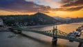 Budapest, Hungary - Aerial skyline view of a beautiful sunset over River Danube and Gellert Hill with sightseeing boat