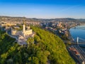 Budapest, Hungary - Aerial skyline view of Statue of Liberty on Gellert Hill at sunrise with clear blue sky Royalty Free Stock Photo