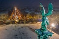 Budapest, Hungary - Aerial view of angel sculpture at Heroes` Square Hosok tere with Christmas decorated Andrassy street