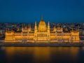 Budapest, Hungary - Aerial view of the beautiful illuminated Parliament of Hungary Orszaghaz at blue hour