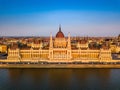 Budapest, Hungary - Aerial view of the beautiful Parliament of Hungary Orszaghaz at golden sunset