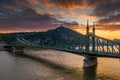 Budapest, Hungary - Aerial view of a beautiful sunset over River Danube with Liberty Bridge, Gellert Hill and Statue of Liberty Royalty Free Stock Photo