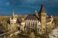 Budapest, Hungary - Aerial view of beautiful Vajdahunyad Castle in City Park at sunset with dark clouds behind