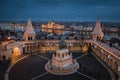 Budapest, Hungary - Aerial view of the famous Fisherman`s Bastion at dusk with illuminated Parliament of Hungary Royalty Free Stock Photo