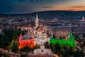 Budapest, Hungary - Aerial view the famous illuminated Fisherman`s Bastion Halaszbastya and Matthias Church in national colors Royalty Free Stock Photo