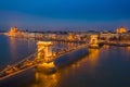 Budapest, Hungary - Aerial view of the famous illuminated Szechenyi Chain Bridge at blue hour with Parliament building Royalty Free Stock Photo