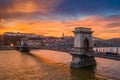 Budapest, Hungary - Aerial view of the famous Szechenyi Chain Bridge with a beautiful golden sunset at winter time Royalty Free Stock Photo