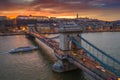 Budapest, Hungary - Aerial view of the famous Szechenyi Chain Bridge with a beautiful golden sunset at winter time Royalty Free Stock Photo