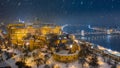 Budapest, Hungary - Aerial view of illuminated Buda Castle Royal Palace on a winter night with heavy snowing Royalty Free Stock Photo